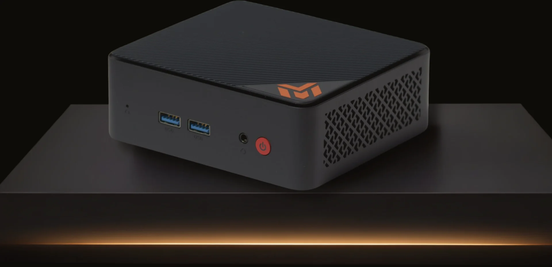 MINEOMATBOX PRO – schwarzes Steuergerät mit orangem MINEOMAT-Logo an der Front, auf dunklem Sockel